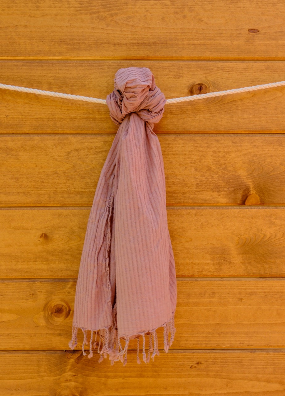 scarf draped over a wooden surface