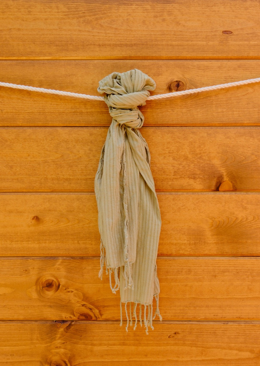 scarf tied  with a wooden wall background