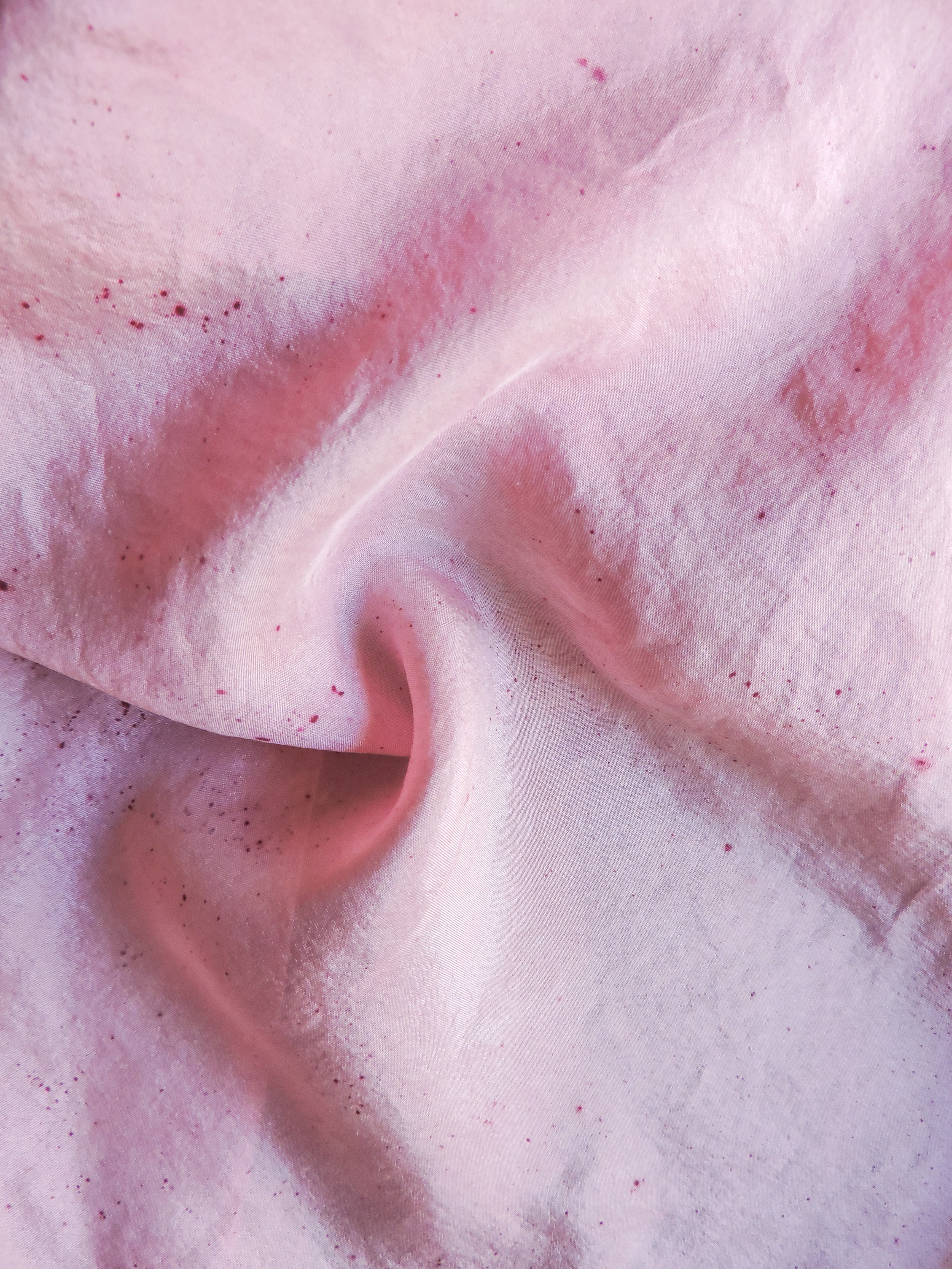 Close-up of pink silk fabric with a soft texture
