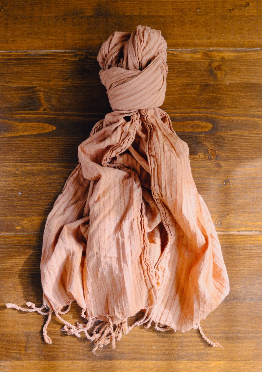 scarf tied in a knot on a wooden surface