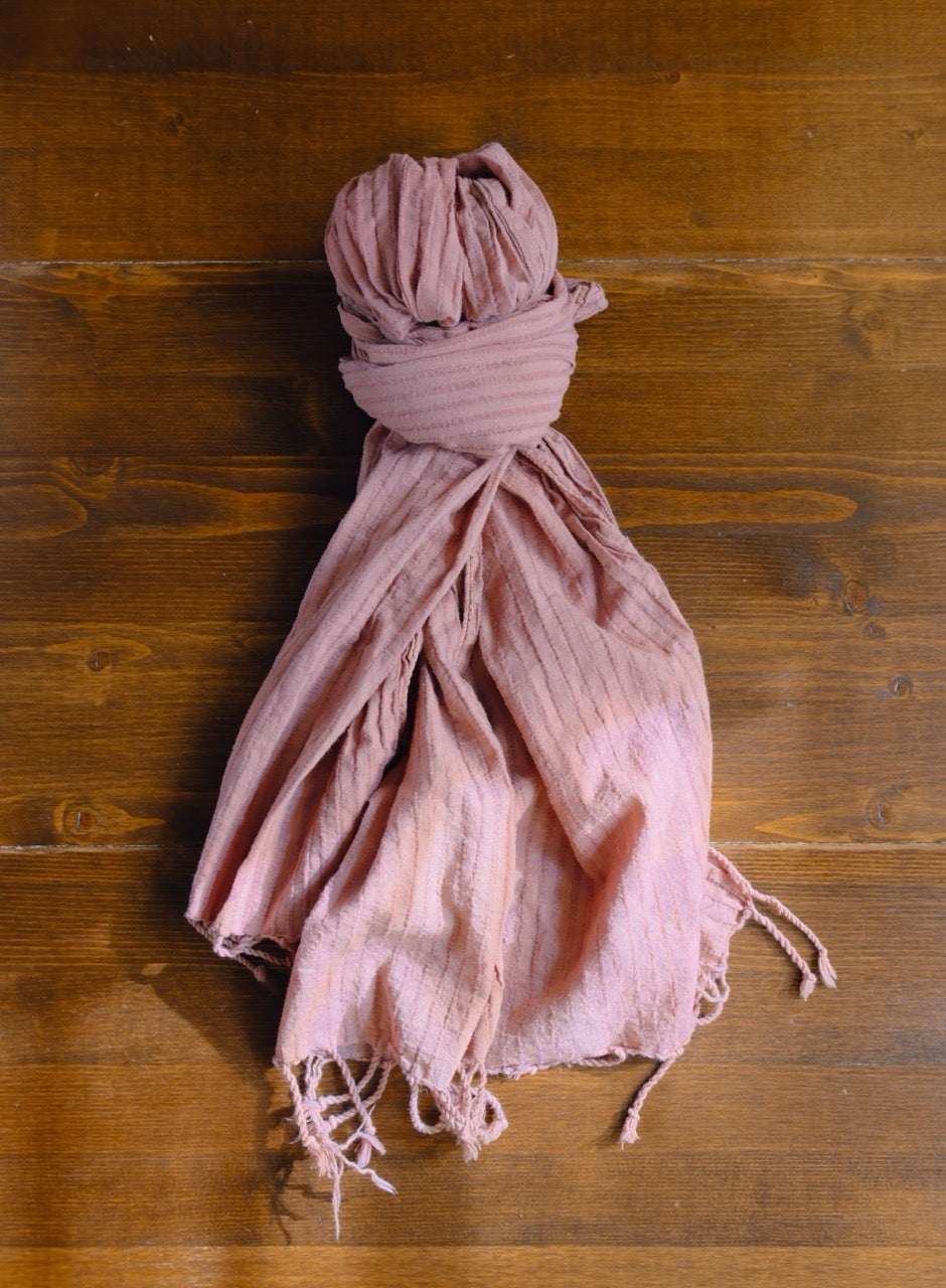 scarf tied in a knot on a wooden surface